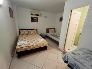 AS MONTENEGRO SUITES客房内的一张或多张床位