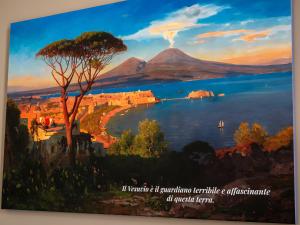 a painting of a view of a lake and a mountain at Vesuvian Tales in San Giorgio a Cremano +45 photos
