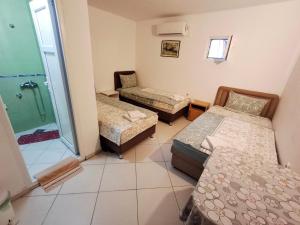 Postel nebo postele na pokoji v ubytování AS MONTENEGRO SUITES + 9 fotografií