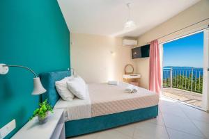 a bedroom with a bed and a large window at Villa Roz by Villa Plus in Plateies +19 photos
