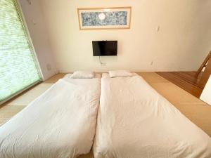 Letto o letti in una camera di ぬちゆい