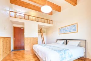 Letto o letti in una camera di ぬちゆい