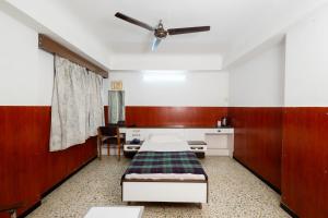 Postel nebo postele na pokoji v ubytování Hotel Srilakshmi
