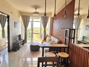 a living room with a table and a couch at Twin AJ Boracay in Boracay