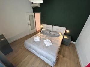 A bed or beds in a room at Swing 69 by PortofinoVacanze
