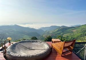 a hot tub sitting on top of a roof at Taara Montana Resort in Ban Huai Khai