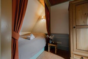 Postel nebo postele na pokoji v ubytování Hotel Vesting Bourtange