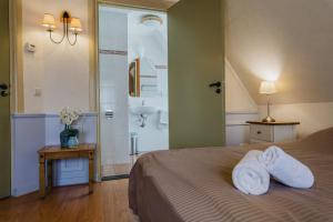 Postel nebo postele na pokoji v ubytování Hotel Vesting Bourtange