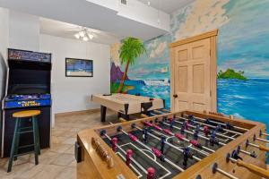 a room with a ping pong table and a game room at 1398 - Alotta Coladas in Corolla