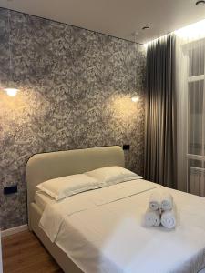 Postel nebo postele na pokoji v ubytování 2 комн квартира в ЖК Altyn Sapa