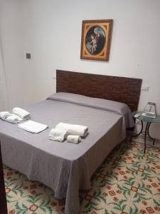 Postel nebo postele na pokoji v ubytování APPARTAMENTI casa GULOTTA + 30 fotografií