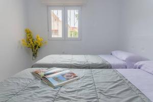 En eller flere senge i et værelse på Casa en Almería