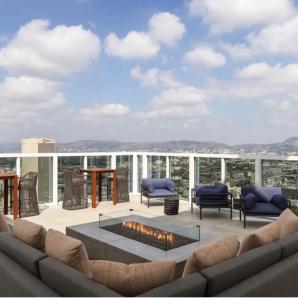 a living room with a couch and a fire pit at Center of Los Angeles Zen Suite 1Bed 1Bath Retreat in Los Angeles +30 photos