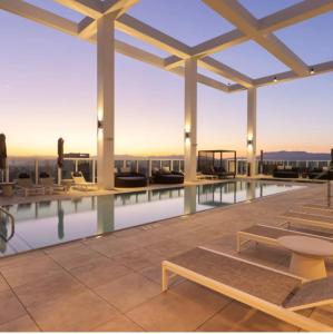 a swimming pool on the roof of a building at Center of Los Angeles Zen Suite 1Bed 1Bath Retreat in Los Angeles