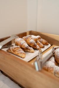 a bunch of pastries on trays in a box at Spazio Mari in Terracina