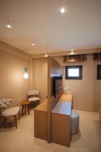 a room with a kitchen and a living room at Parga Harbor Suites in Parga