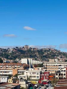 a view of a city with houses and buildings at RAMI Appart in Antananarivo