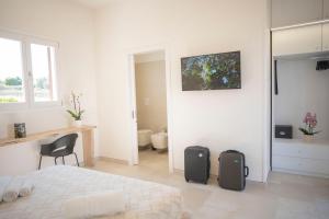 TV a/nebo společenská místnost v ubytování Masseria Un Posto al Sole