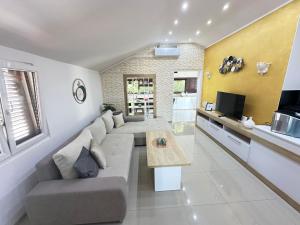 a living room with a couch and a table at La Familia in Šibenik