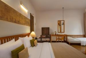 Postel nebo postele na pokoji v ubytování SigiriyaJungles Resort & Spa