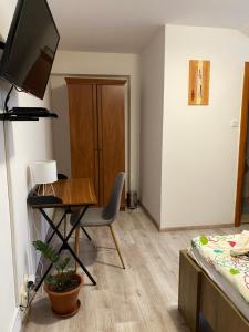 A television and/or entertainment centre at Penzión Nezábudka