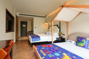 Candy Homestay Zhangjiajie Complimentary Airport & Train Station Pickup客房内的一张或多张床位