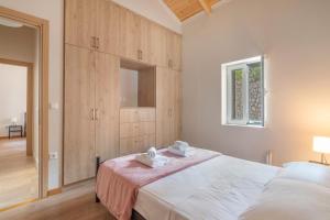 Postel nebo postele na pokoji v ubytování Ionian Home