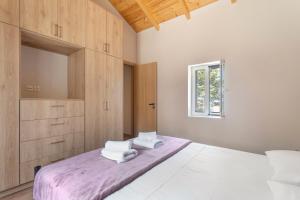 Postel nebo postele na pokoji v ubytování Ionian Home