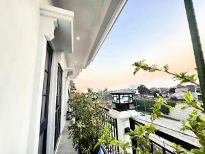 an apartment balcony with a view of the city at wendy syariah mansion in Gandul