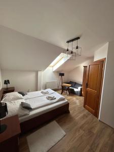 A bed or beds in a room at Penzión Nezábudka