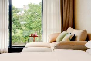 Candy Homestay Zhangjiajie Complimentary Airport & Train Station Pickup客房内的一张或多张床位