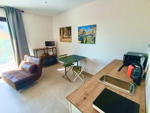 a living room with a couch and a table at Oceanfront apartment in Premiá de Mar