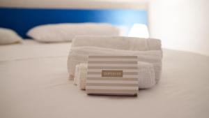 Postel nebo postele na pokoji v ubytování Cugnana Nest