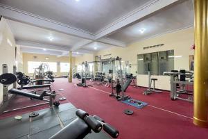 a gym with a large room with tread machines at Hotel Ramayana Garut in Garut