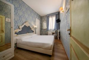 Posteľ alebo postele v izbe v ubytovaní Locanda Antica Venezia