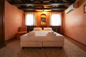 Posteľ alebo postele v izbe v ubytovaní Locanda Antica Venezia