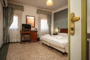 Posteľ alebo postele v izbe v ubytovaní Locanda Antica Venezia