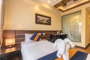 Letto o letti in una camera di Devo Boutique Hotel