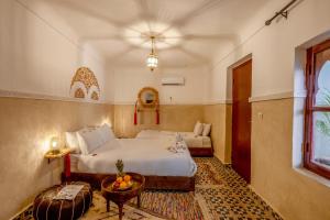 Voodi või voodid majutusasutuse Riad Mokha Mokha & Spa toas