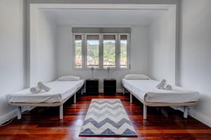 Posteľ alebo postele v izbe v ubytovaní Apartamento Ulia by SanSe Holidays