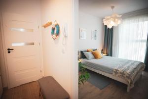 Postel nebo postele na pokoji v ubytování Apartament Strzelców 4
