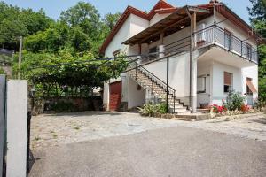 a house with a staircase in front of it at Villino Chiara in Pannesi
