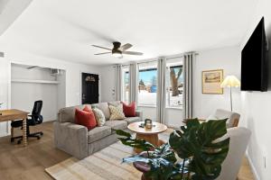 a living room with a couch and a table at Cozy 1BR Lower Flat in Royal Oak in Royal Oak