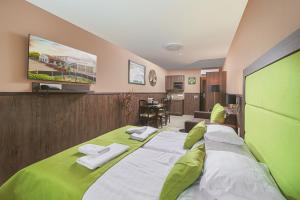 Postel nebo postele na pokoji v ubytování Park Hotel Bükfürdő