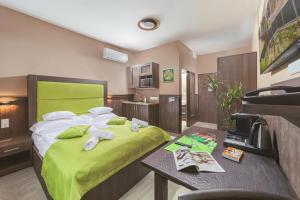 Postel nebo postele na pokoji v ubytování Park Hotel Bükfürdő