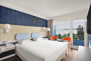 Posteľ alebo postele v izbe v ubytovaní Danubius Hotel Annabella
