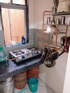 Kuchyň nebo kuchyňský kout v ubytování Aapka home