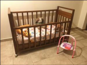 a baby crib with a crib at Ηρεμία - Φύση in Kastanéa
