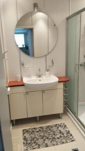 a bathroom with a sink and a mirror at Yana Privilege apartment Elinite in Elenite
