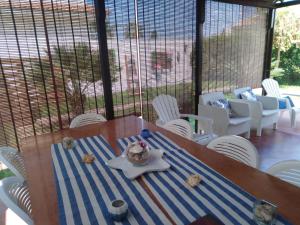 a table with a plate of food on top at Summer Rooms Caucana in Punta Secca